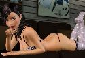 Hot chick in tight bikini posing showing butt
